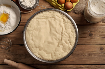 dough on wooden table closeup in a bakery