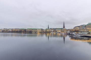 Serene cityscape landscape scene. Long exposure, blurry sea/rive