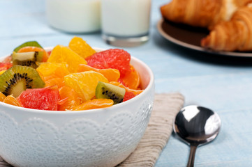 Fruit salad in a ceramic bowl with a pattern
