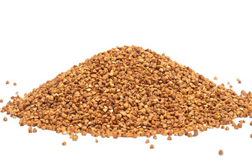 Heap of buckwheat grains on white background, close up view.