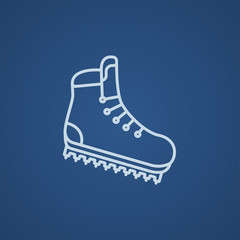 Hiking boot with crampons line icon.