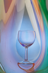 Wine glass on an abstract colored background