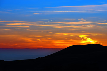 Sunset Over the Mountain / Beautiful sunset in the Italian Alps with the fog in the Padana valley (Po Valley) and the Apennines to the horizon