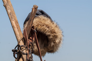 historical fur hat medieval blacksmith hanging