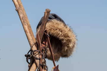 historical fur hat medieval blacksmith hanging