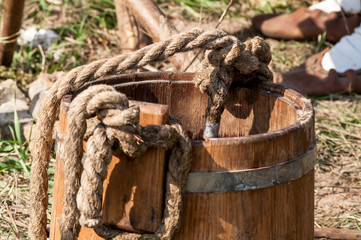 wooden bucket with a mop