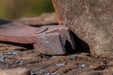 medieval iron tongs and anvil blacksmith closeup