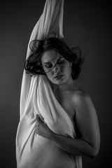 Greek woman, ancient goddess with white cloth in the wind