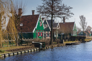 Fototapeta na wymiar Traditional Dutch old wooden windmill in Zaanse Schans