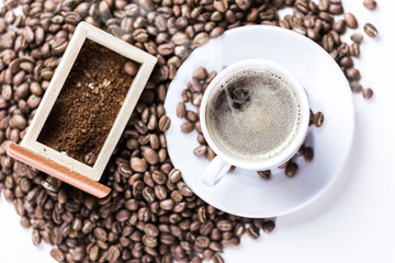 Coffee grains and coffee cup