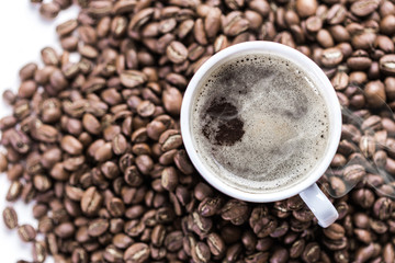 Coffee grains and coffee cup