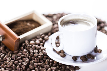 Coffee grains and coffee cup