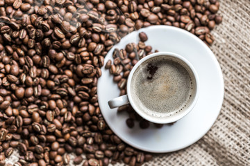 Coffee grains and coffee cup