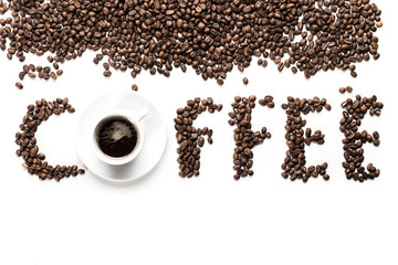 Coffee grains and coffee cup