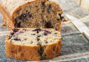 Home baked lemon cake with blueberries close up