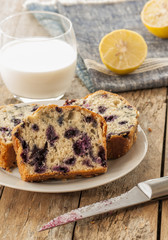 Home baked lemon cake with blueberries close up