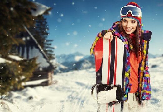 sexy woman with snowboard outdoors