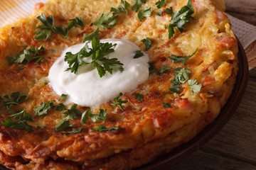 Potato pancakes with sauce on a plate macro. horizontal

