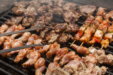 various meat chicken wings steaks grilled on brazier