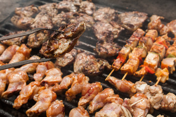 various meat chicken wings steaks grilled on brazier