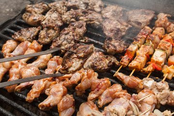 various meat chicken wings steaks grilled on brazier