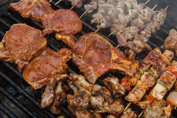 various meat chicken wings steaks grilled on brazier