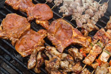 various meat chicken wings steaks grilled on brazier