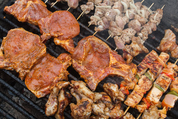 various meat chicken wings steaks grilled on brazier