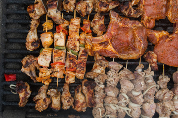 various meat chicken wings steaks grilled on brazier