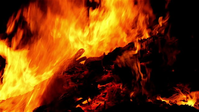 CLoser look of the bonfire on the night time. A bonfire is a large but controlled outdoor fire used either for informal disposal of burnable waste material or as part of a celebration.