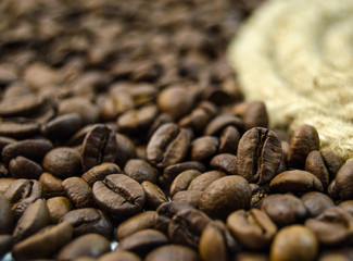 Roasted coffee beans beside the rope