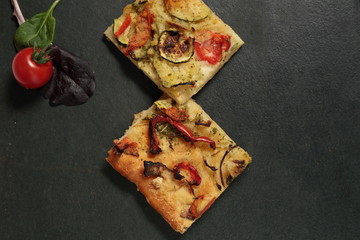 Elche coca vegetables on slate background

