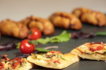 Elche coca vegetables on slate background
