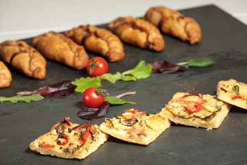 Elche coca vegetables on slate background
