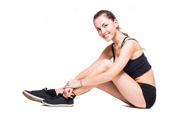 Fototapeta na wymiar Attractive fit woman exercising in studio with copyspace. Image of healthy young female athlete doing fitness workout against grey background.