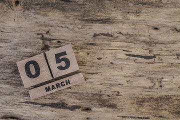 cube calendar for march on wooden surface with copy space (daily)