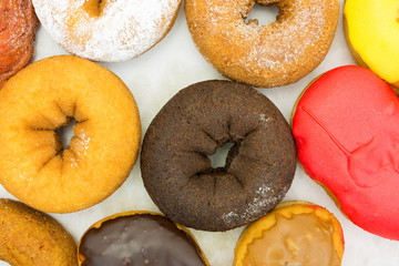 Assorted donuts in box top close view