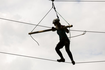 Silhouette of woman on aventura park.