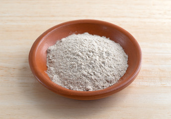Brown gravy dry mix in bowl on counter top
