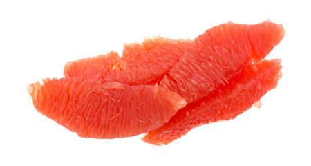 Red grapefruit sections on a white background