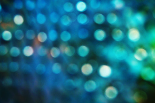 Blue blurred background with sparkles closeup
