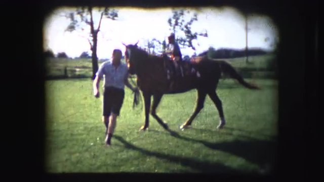 Vintage 8mm footage of people riding a horse near their house on their property