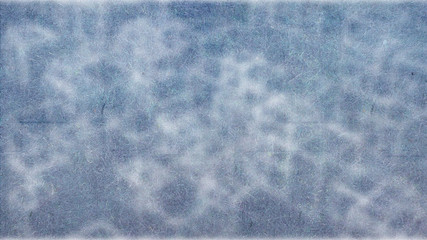 Background of blue grass with frost that grows irregularly, but also beautiful