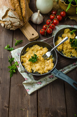 Scrambled eggs with herbs and homemade bread