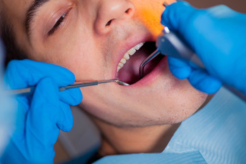 Dentist treatment a patient's teeth in the dentist.