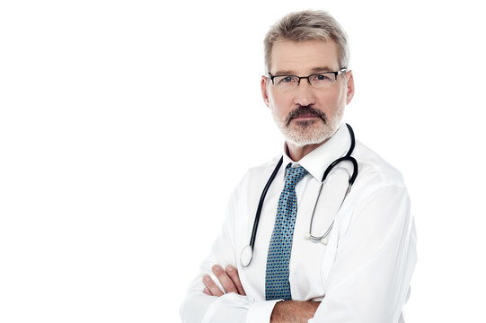 Senior male doctor with crossed arms