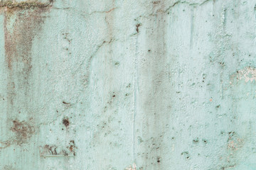 Weathered and aged turquoise concrete wall texture background.