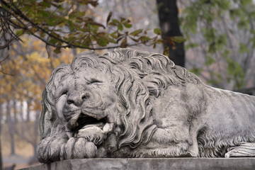 Fototapeta na wymiar Lion statue on pedestal
