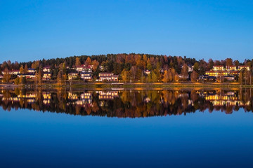 Fototapeta na wymiar Almost perfect reflection next to a lake in Finland