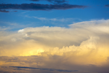 Light and orange sunset in the clouds over Bolivia